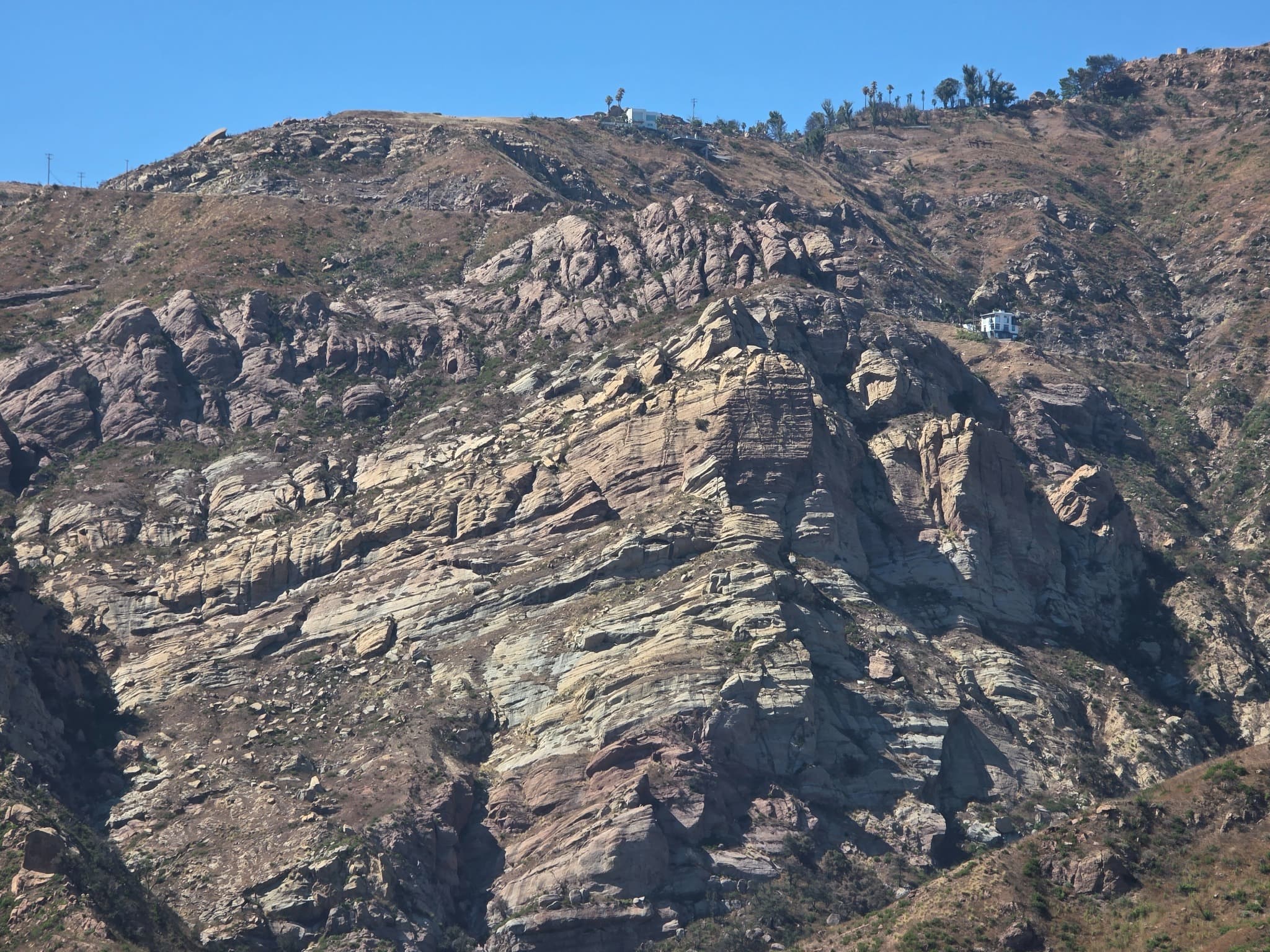 Exposed bedrock and steep hillside geology in Southern California